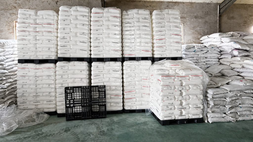 Warehouse storage of white packaged rolls